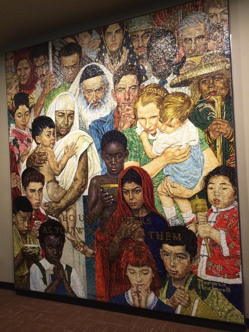 Glass mural representing a world of peaceful collaboration.